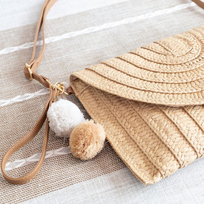 Woven Straw Flap Clutch with Tassel Accent