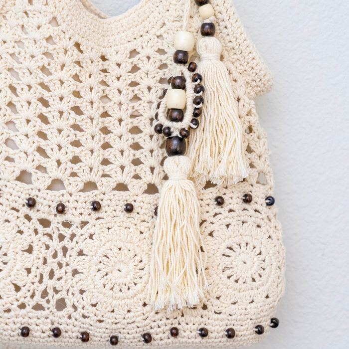 Openwork Crochet Hobo Tote with Tassel and Wooden Bead